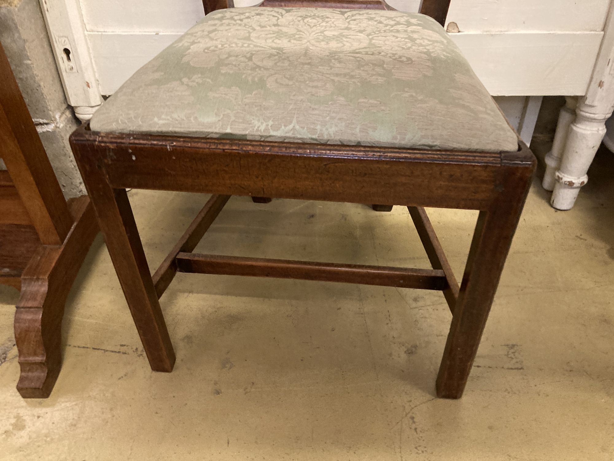 A 19th century Chippendale design mahogany dining chair, with pierced splat back over a drop in set and square underframe